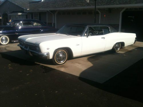 1966 chevy caprice  2 door, bucket seats, white with black vinyl top