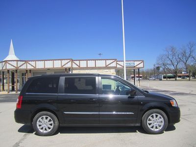 Brand new sleek black 2013 chrysler town &amp; country touring