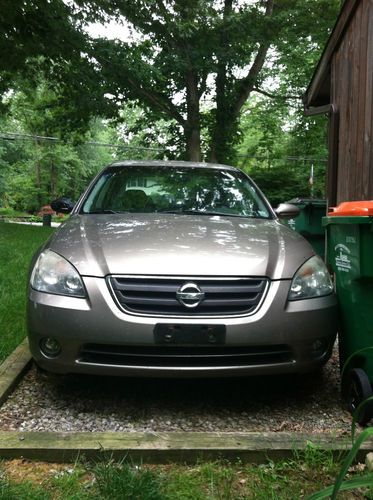 2002 nissan altima sl,taupe, 4 dr sedan. leather interior. manual transmission.