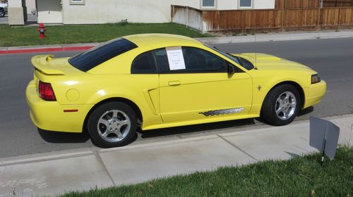 2003 ford mustang w/ pony package runs great !!  zinc yellow
