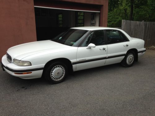 White sedan with blue cloth interior very well kept