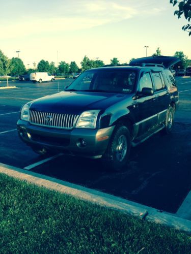 2003 mountaineer navy blue, v8, good condition, third row seat