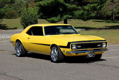 Sweet resto mod camaro pearl yellow suede interior foose wheels stereo system!