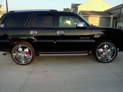 2004 cadillac escalade awd with 26 inch rims and factory rims new winter tires