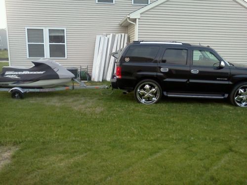 2004 Cadillac Escalade AWD with 26 inch rims and factory rims new winter tires, image 5