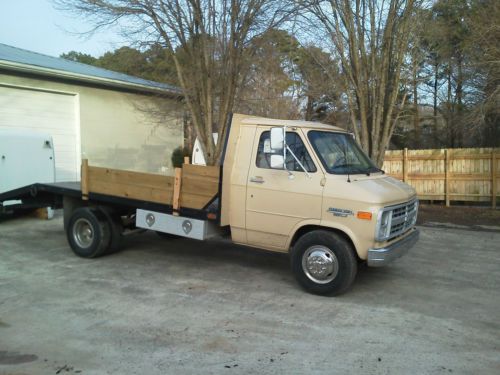 Flat bed truck, new tires(all 6) new a/c, runs strong, has dove tail with ramps