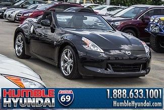 Low miles convertible 6spd, navigation, leather, power heated/cooled seats.