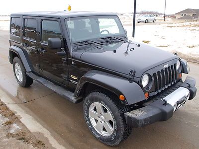 2011 jeep wrangler unlimited / black / hardtop / 6 speed manual / sahara edition