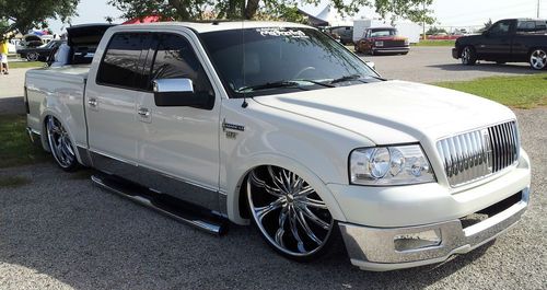 Bagged show truck 2006 lincoln mark lt on 28s laying frame