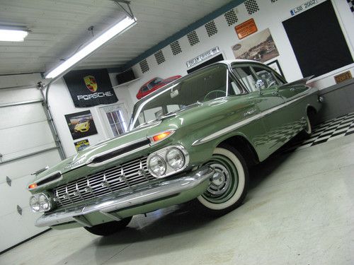 Big finned 4 door belair, low miles, nice stance, very cool!
