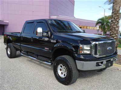 Lifted srw 4x4 lariat leather crew long diesel alloys nice truck fl