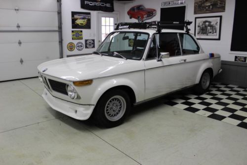 White slicktop roundie stainless header, ansa tips, yakima rack