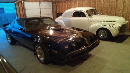 Car is in excellent condition, both inside and out.  black with tan interior.