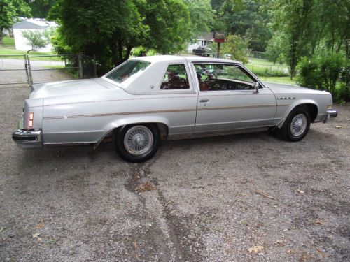 Exterior is silver-grey,interior is red 2dr perfect condition interior