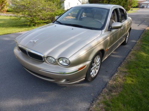 Gold, leather, like new tires, clean, low miles v6. daily drive ready