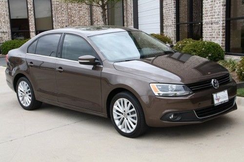 Navigation,bluetooth,auto,vw warranty,moonroof,17's,toffee brown/beige leather!!