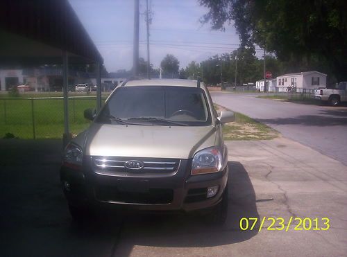 2005 kia sportage 4-door champagne outside tan leather interior low milage