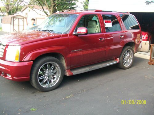 Custom paint inferno red, tow package chrome wheels,stock wheels, 6 cd bose