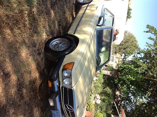 Mercedes 1977 450sl 2 door  convertible pale yellow w/ black interior