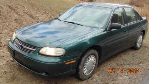 Good used sedan green exterior with a tan/grey interior great car no reserve!!!!