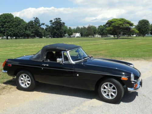 74 mgb roadster.  completely rebuilt.  black and black leather inside, chrome