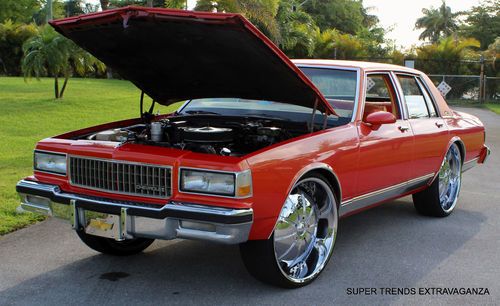 Custom 1989 chevrolet caprice brougham on 26" rock star rims 350ci pearl orange