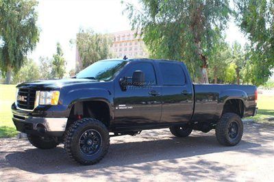 Lifted duramax diesel 4x4 fabtech lift american racing wheels rear airbags