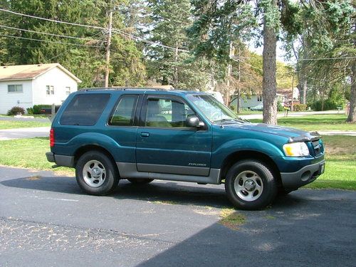 Teal  2 door with hatch - moon roof.  4.0l engine