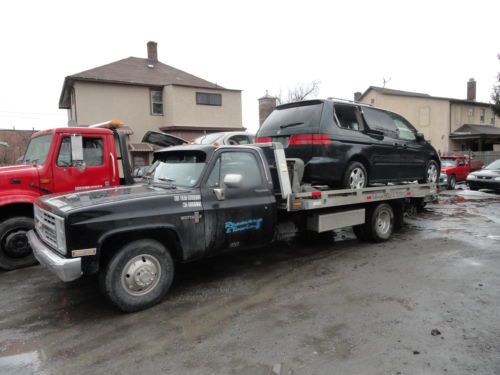 1987 chevy 3500  rollback with 17&#039; aluminum bed 454 cid ,4 speed trans.