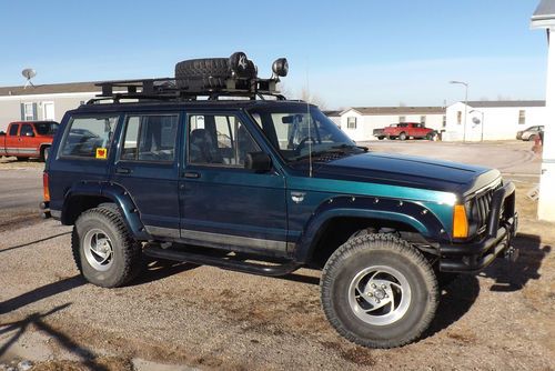 Tricked out!!!!!  1995jeep cherokee with 327 chevy motor only 4,300 miles