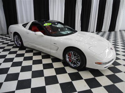 2002 corvette..6 speed..torch red leather..chrome z06 wheels..two tops