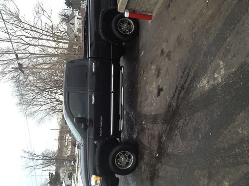 Great 4x4 3500 black in color lariat editon dodge 5.9 cummins