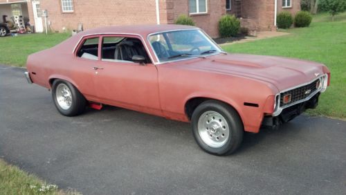 1974 spirit of america hatchback,red,black int.,bucket seats,factory floor shift