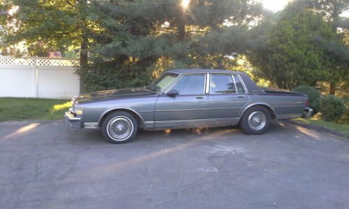 Two  tone black/grey 4 door sedan 8 cylinder engine