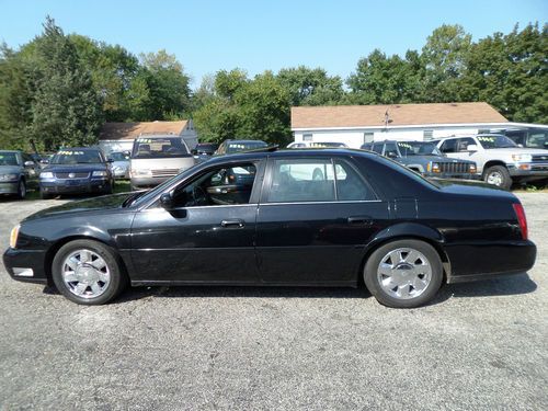 2003 cadillac deville dts ,105k miles,runs well,cold ac,no reserve.