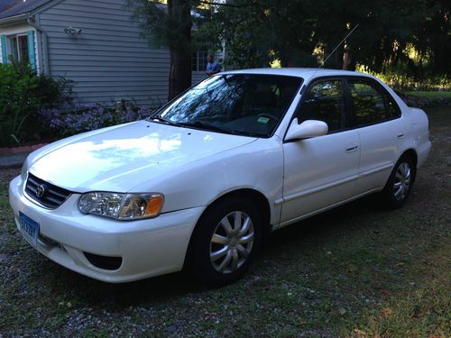 4-door sedan, white, automatic, new wheels.