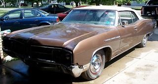 1968, convertible, brown color, all original parts, stored in garage, some rust