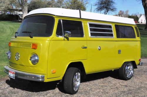 Recently restored classic green 1978  volkswagon camper van bus