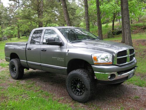 2006 dodge ram 2500 with 5.9 cummings diesel, 4" lift and new tires and wheels