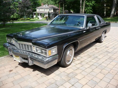 Black cadillac coupe deville.