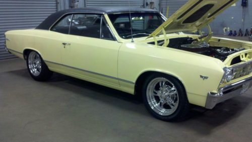 1967 chevelle malibu butternut yellow w/black vinyl top.  327 300 hp engine