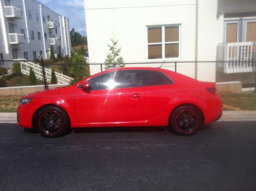 Kia forte koup sx- red w/ black wheels- 57000 miles