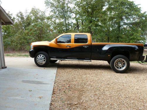 Fusion orange over black paint/4 door dually, one of a kind.