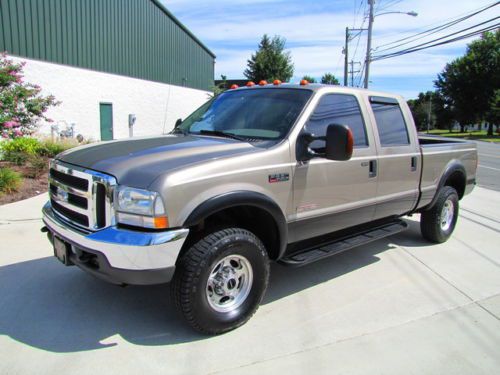 Turbo diesel 4x4 lariat luxury truck ! lifted ! new tires ! premium sound !04