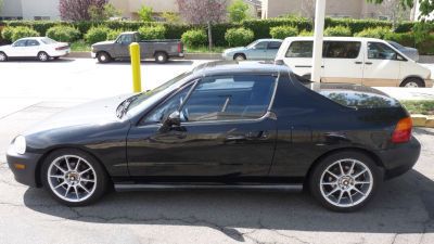 97 black honda del sol 163k targo top 15in rims power ac is good automatic