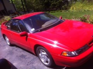 Lsi red with sunroof; has only 77,519 miles