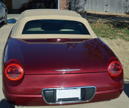 Garage kept, &lt; 60,000 miles, clear ok title, color merlot, interior light sand