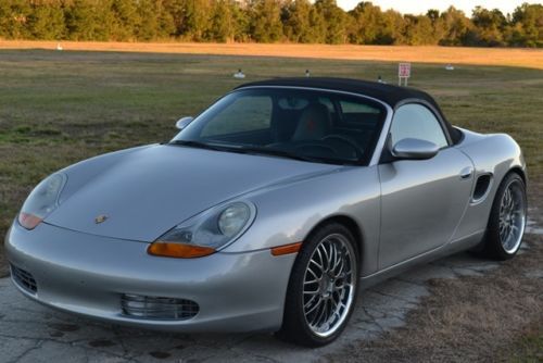 98 boxster, champion wheels. heated leather seats, custom head rest,5 speed