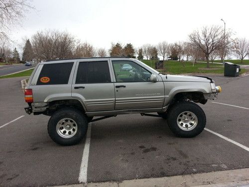 Lifted grand cherokee zj with rusty's long arm kit at no reserve!