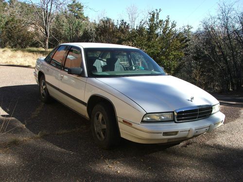 1993 buick regal. white. 4 door. 3.8 liter 6 cylinder front wheel drive